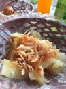 Yuca boiled and chicharrones traditional corn doug fried snacks on a old carbon based stove Royalty Free Stock Photo