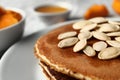 Plate with hot tasty pancakes and pumpkin seeds, closeup Royalty Free Stock Photo