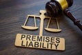 Plate with inscription Premises liability and gavel. Royalty Free Stock Photo