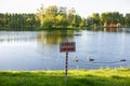 The plate with the inscription - swimming is forbidden.