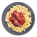 Plate with italian macaroni with pepperoni and tomato sauce isolated over white background Royalty Free Stock Photo