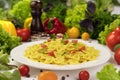 Plate of italian pasta, farfalle with tomatoes and basil