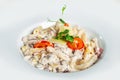 Plate of Italian penne pasta topped with a creamy sauce. Royalty Free Stock Photo