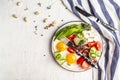 Plate with a keto diet food. paleo keto breakfast fried eggs, bacon, avocado, cheese and fresh salad. Keto, paleo breakfast. Top Royalty Free Stock Photo