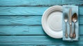 A plate, knife and fork on a blue table with napkin, AI Royalty Free Stock Photo