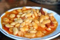 Plate of kuru fasulye white beans cooked in a spicy tomato sauce