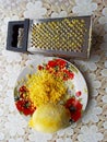 Plate with lemon, citron and grater on table