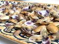 A plate of little clams with lemon, a typical spanish tapa Royalty Free Stock Photo