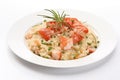 Plate of Lobster Risotto with shrimps and green peas on white background Royalty Free Stock Photo