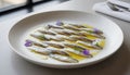 plate of marinated anchovy known as boqueron from spain served in modern restaurant Royalty Free Stock Photo