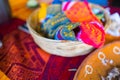 Plate of Mexican chopped lamb meat and tortilla basket on colorful tablecloth