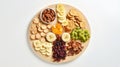 On the plate mix of dried fruits - bananas, oranges, mangoes and other exotic fruits. Healthy eating