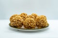 A plate of Murmura Murai Ladoo Puffed Rice in Jaggery Balls Maghe Makar Sankranti Festival