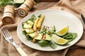 Plate with mussels and vegetables on table Royalty Free Stock Photo