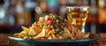 Plate of Nachos and Glass of Beer Royalty Free Stock Photo