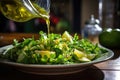 A plate of nutritious salad with delicious dressing being poured onto it, creating a mouthwatering and wholesome meal., A spritz Royalty Free Stock Photo