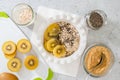 Plate of oatmeal made with whole grain oats, flaxseed meal,  Chia seeds, and served with sweet golden kiwi, flat lay Royalty Free Stock Photo