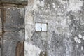 Plate on the old house wall with the number Royalty Free Stock Photo
