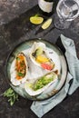 A plate of oysters with different fillings of citrus fruits Royalty Free Stock Photo