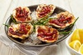 Plate of Oysters Kilpatrick with Napkin and Lemon Royalty Free Stock Photo