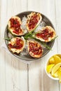 Plate of Oysters Kilpatrick with Napkin and Lemon Royalty Free Stock Photo