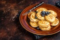 Plate with pancakes with fresh blueberries and syrup . Dark background. Top View. Copy space Royalty Free Stock Photo
