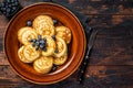 Plate with pancakes with fresh blueberries and syrup . Dark background. Top View. Copy space Royalty Free Stock Photo