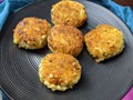 A plate with Paneer Cutlet, a breaded crispy patty