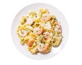 Plate of pasta fettuccine with cream sauce and shrimps isolated on a white background Royalty Free Stock Photo