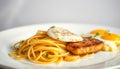 Plate of pasta with meat and eggs on top Royalty Free Stock Photo