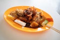 A plate of Penang rojak which is a delicacy typically consists of cucumber, pineapple, deep-fried tofu, mango and cuttlefish