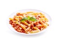 Plate of penne pasta bolognese on white background Royalty Free Stock Photo