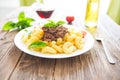 Plate of penne pasta bolognese on wooden table Royalty Free Stock Photo