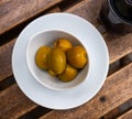 Plate of pickled green olives without stone, spanish appetizer - Olivas verdes sin hueso