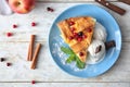 Plate with piece of delicious apple pie and ice cream on wooden background Royalty Free Stock Photo