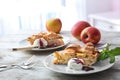 Plate with piece of delicious apple pie and ice-cream on wooden table Royalty Free Stock Photo