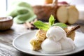 Plate with piece of delicious apple pie and ice cream on wooden table, closeup Royalty Free Stock Photo