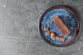 Plate with piece of delicious chocolate cake on grey table Royalty Free Stock Photo