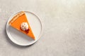 Plate with piece of fresh delicious homemade pumpkin pie on gray background, top view Royalty Free Stock Photo