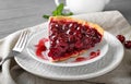 Plate with piece of tasty homemade cherry pie on table, closeup Royalty Free Stock Photo