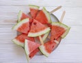 Plate of a piece of watermelon tasty snack refreshment on a wooden background