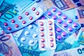 Plate with pills on the background of euro bills. The concept of the expensive cost of healthcare Royalty Free Stock Photo