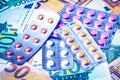 Plate with pills on the background of euro bills. The concept of the expensive cost of healthcare Royalty Free Stock Photo