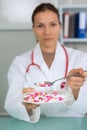 Plate pills in doctors hand