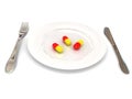 Plate with pills over white Royalty Free Stock Photo