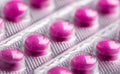 Plate of pink pills Royalty Free Stock Photo