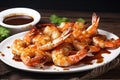 plate of piping hot tiger shrimp prawns with tangy spicy sauce