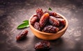 Plate of pitted dates on a dark wooden background. Top view