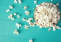 Plate of popcorn on a blue wooden background, top view Royalty Free Stock Photo