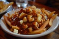 plate of poutine, a Canadian snack with french fries, cheese curds, and gravy, in the style of indulgent, cheesy, gooey